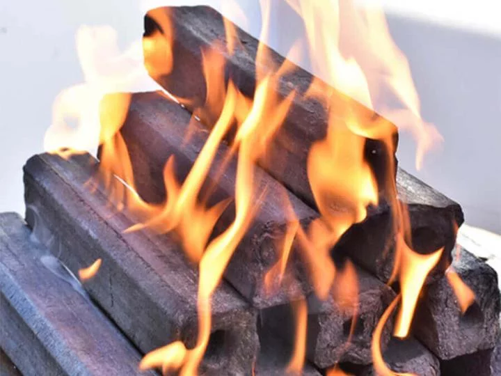 burning charcoal briquette